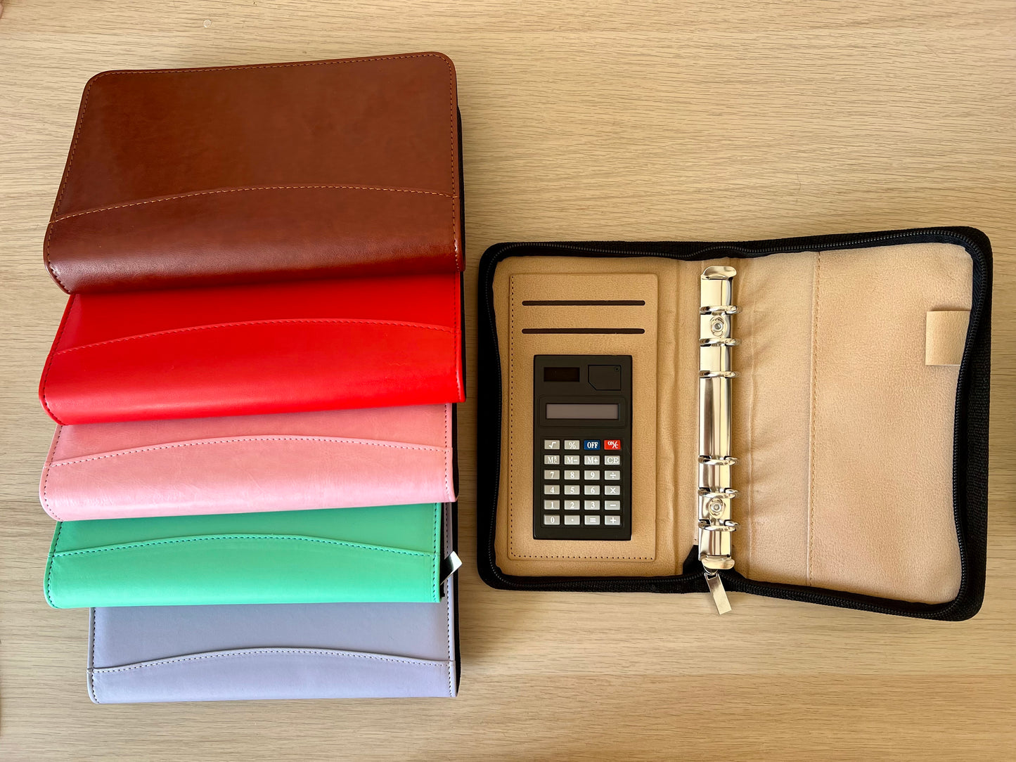 Classeur portefeuille à anneaux fermeture zip et calculatrice intégrée